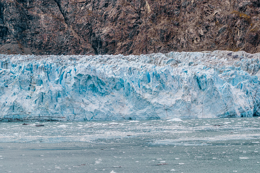 Alaska glacier front in Glacier Bay National Park. Blue Ice global warming. USA travel destination.