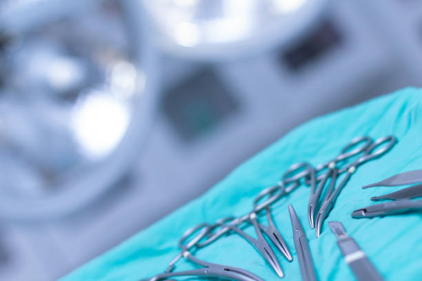 Surgical instruments on a table in an operating room stock photo