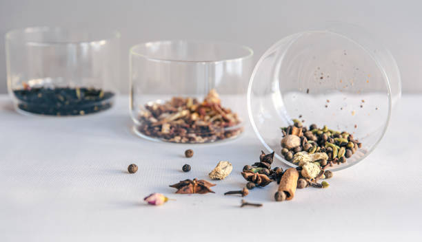 istock Different types of tea in glass jars on a light background, isolated. 1371801324