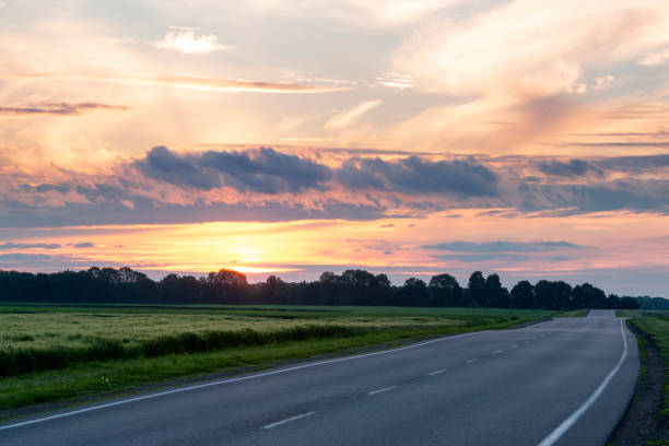 istock Moody sunset on the road 1371802699