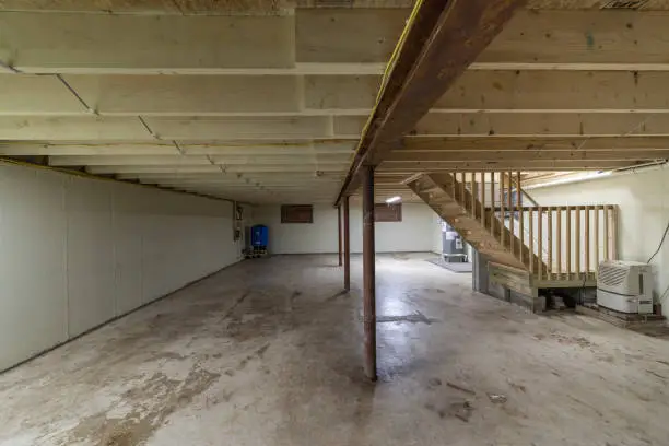 Photo of Basement with appliances in a residential house, empty, clean, and ready for sale.