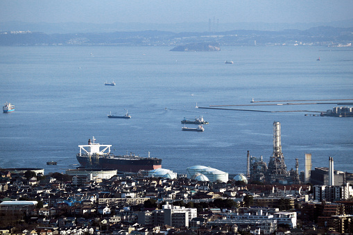 Navy frigate moored at naval dockyard.