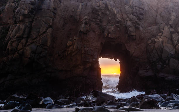 istock The sun peeking through keyhole arch 1371808820