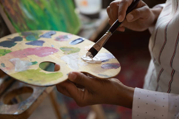 istock Close up focus on palette with mixed paints. 1371808861