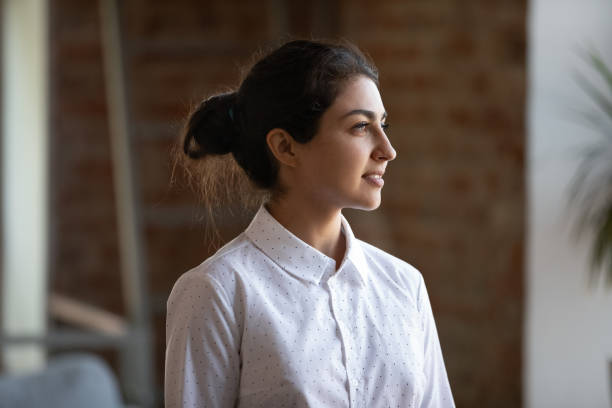 istock Happy young female Indian businesswoman visualizing future. 1371808863