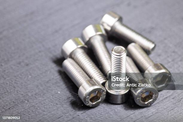 Chrome Inbus Nuts On The Black Background Workshop Concept With Chrome Nuts Stock Photo - Download Image Now