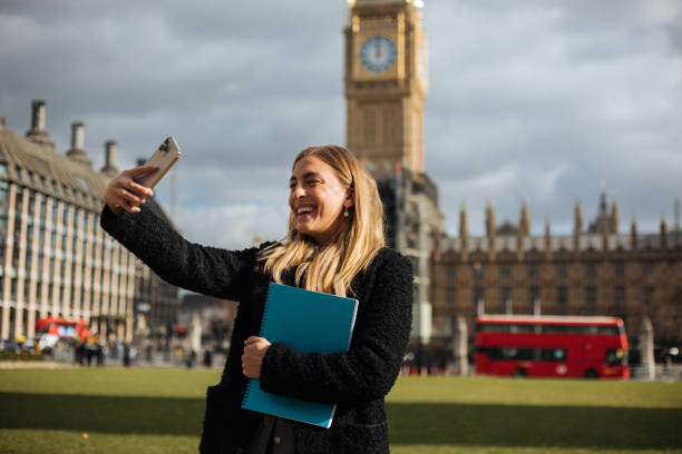 istock Happy female student taking selfie in London 1371809880