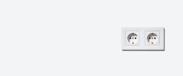 istock Two sockets in a white frame on a white wall. Banner. 1371811376