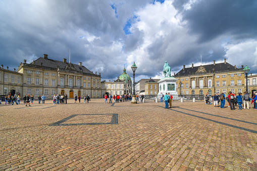 Panoramic view of Amalienborg Palace and Frederick V Statue with a blue sky - Copenhagen, Denmark