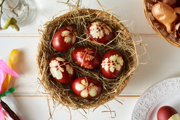 istock Easter eggs dyed with onion peels in a wicker basket, top view 1371812210