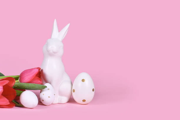 istock Easter bunny, white eggs with golden dots and tulip spring flowers 1371813502