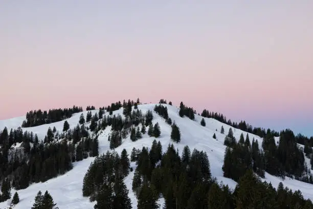 Photo of Amazing morning view and an epic sunrise with pink and blue tones. Epic long exposure shot in the heart of Switzerland. Wonderful scenery with the majestic mountain called Grosser Mythen in the background.