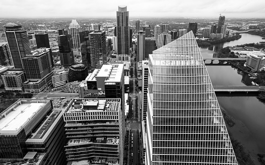 Urban Austin Manhattan the growing Texas City Outgrowing the Big Cities - Austin Texas Cityscape 2022 Aerial drone views of the brand new skyscrapers changing the Skyline forever. Black and white amazing sunny days in the capital city from above