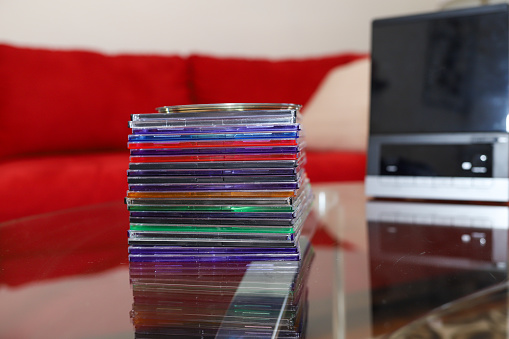 A stack of audio CD disk  sitting on a table