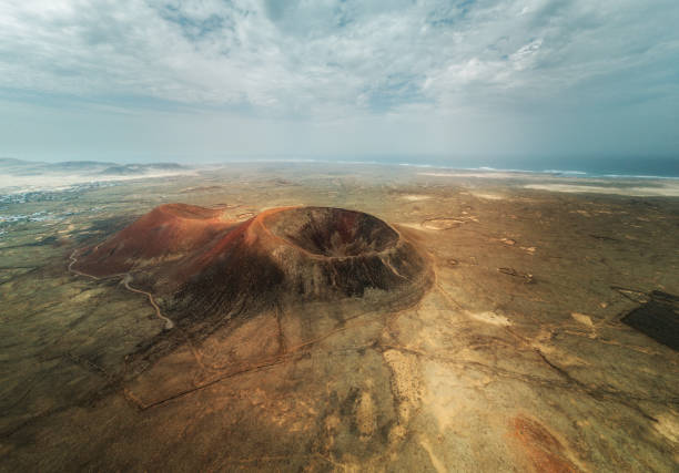 Volcano Calderón Hondo on Fuerteventura Spain aerial drone under cloudy sky stock photo