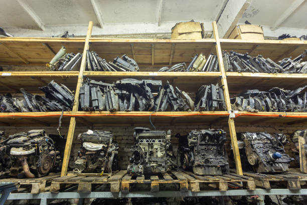 Warehouse with used auto parts for sale. Radiators of the cooling system and engines on the shelves of the warehouse. Trade in used spare parts is a common business in developing countries.