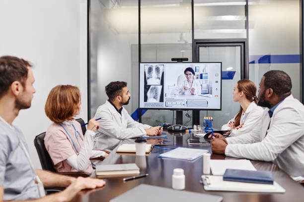 istock Large group of intercultural medical workers watching online presentation 1371822416