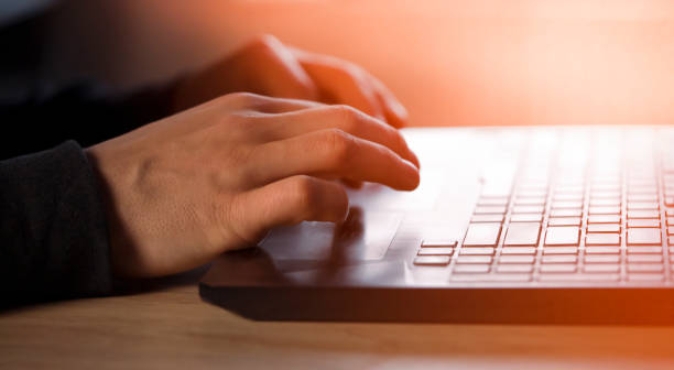 istock Man is typing on a laptop keyboard, hands closeup. 1371824864