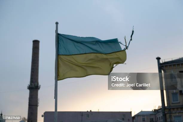 Ukrainian Flag In Kyiv Battered By The Elements Stock Photo - Download Image Now - Ukraine, Kyiv, Ukrainian Flag