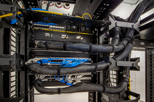 Server room wiring with cable wraps.