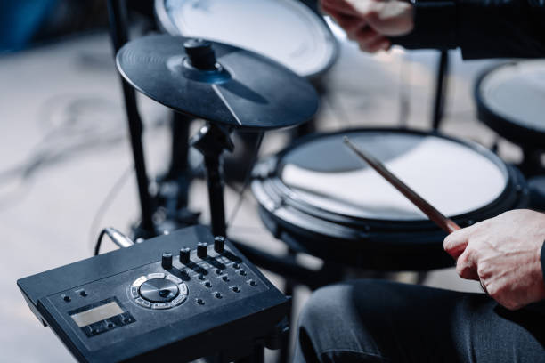 istock Close-up of electronic drums on stage during a performance. Mesh-head drum pads, rubber pads, cymbal pads and acoustic drum triggers. 1371831296