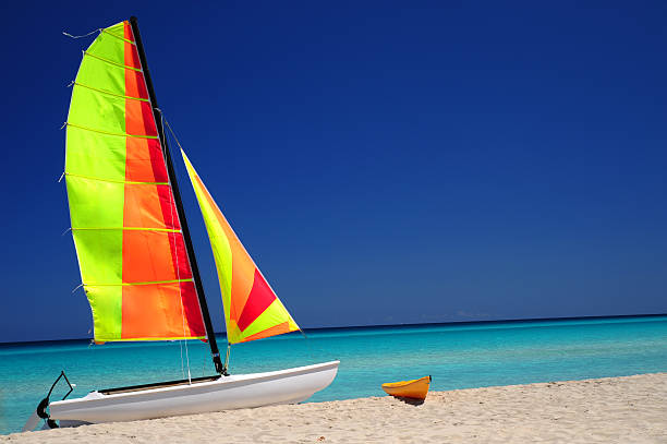 istock Canoe and catamaran oncaribbean beach 137183882