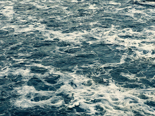 Swirled water at the waterfall in winter.