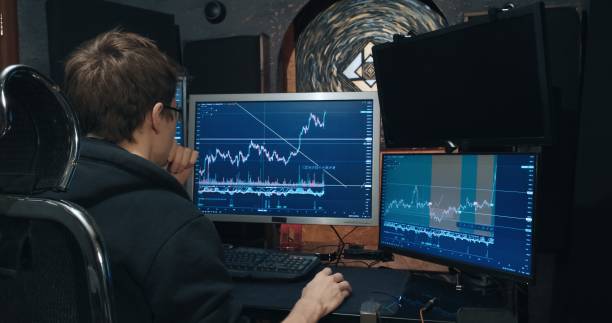 istock Man trader, freelancer on stock exchange trades options at home computer 1371841944