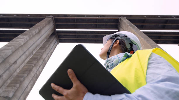 istock Female road engineer working. Building new highways. 1371842063