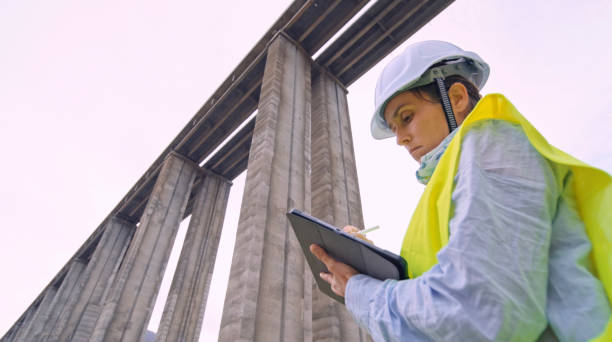 Female road engineer working. Building new highways.