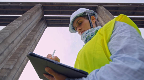 istock Female road engineer working. Building new highways. 1371842067