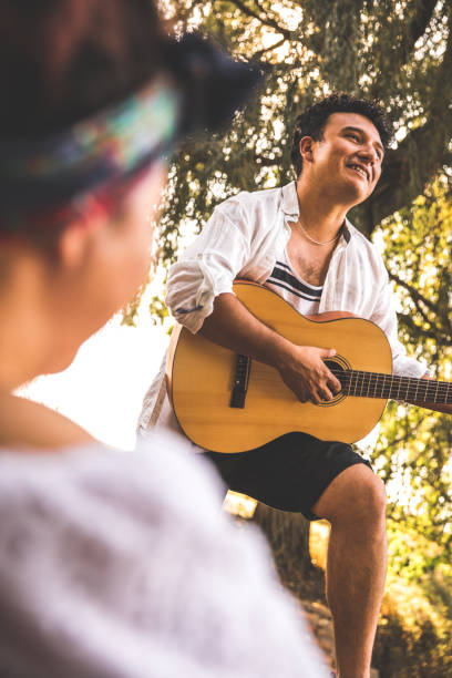 istock Enjoying playing the guitar and singing 1371843596