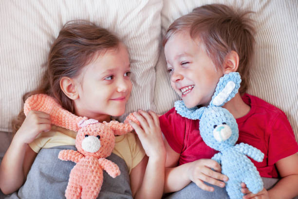 Portrait of cute little girls posing with their toys