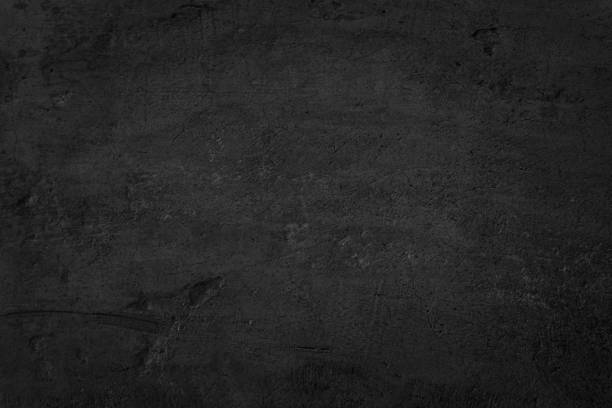 istock Close up retro plain dark black cement & concrete wall background texture for show or advertise or promote product and content on display. 1371846996