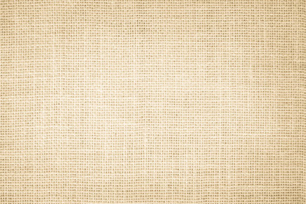 istock Jute hessian sackcloth burlap canvas woven texture background pattern in light beige cream brown color blank. Natural weaving fiber linen and cotton cloth texture as clean empty for decoration. 1371847730