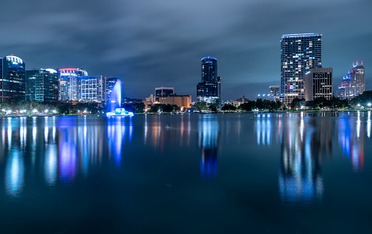 Illuminated fountain on the Lake Eola in Orlando Downtown, Florida, in the night.