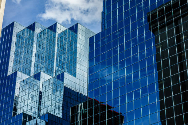 istock Glass Skyscrapers Against Blue Sky on Sunny Day 1371850544