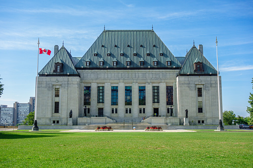 Supreme Court of Canada Building on Sunny Summer Day with Green Grass and Blue Sky