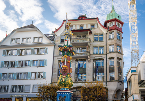 Luzern, Switzerland - Nov 27, 2019: Fritschi Fountain (Fritschibrunnen) at Kapellplatz - Lucerne, Switzerland