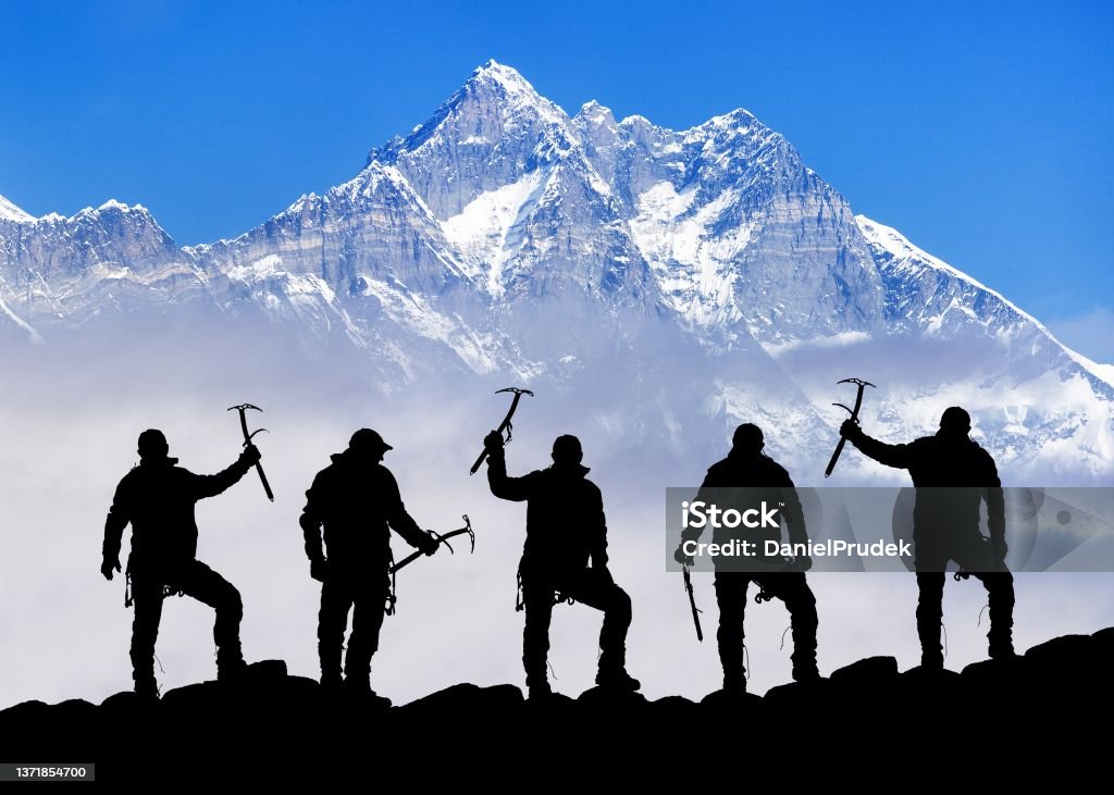 mount Lhotse silhouette climbers with ice axe in hand View of mount Lhotse and silhouette of group of five climbers with ice axe in hand, Everest area Khumbu valley, Sagarmatha national park, Nepal Mountain Climbing Stock Photo