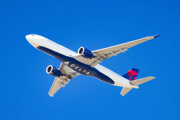 East Hills, NY, USA - February 20, 2022: Delta Air Lines A330-900 NEO Aircraft approaching JFK International Airport over Long Island, New York