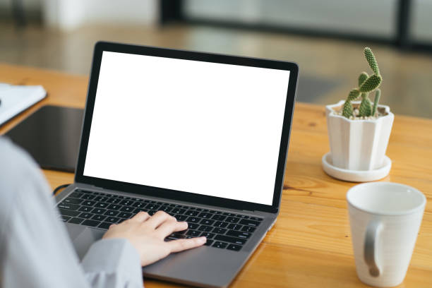 istock Close up image of a female assistant working on laptop computer at her workspace. laptop blank screen mockup. 1371858613