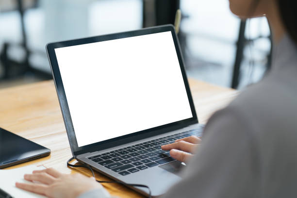 istock Close up image of a female assistant working on laptop computer at her workspace. laptop blank screen mockup. 1371859745