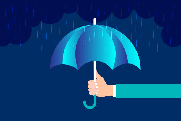istock Hand of businessman holds an open blue umbrella from the rain 1371863986