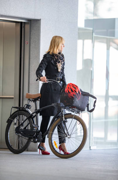 istock Businesswoman commuter using for the elevator in the office building 1371864399