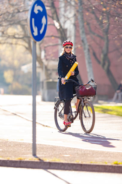 istock Female Architect commuting to work with a bicycle 1371864415