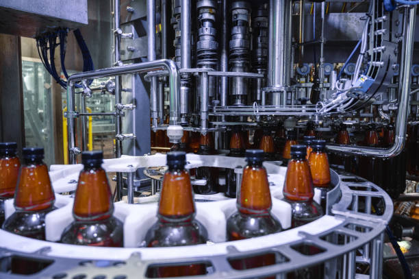 istock Automatic filling machine, the process of filling plastic bottles with various drinks 1371877324