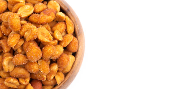 istock Honey Roasted Peanuts Isolated on a White Background 1371880633