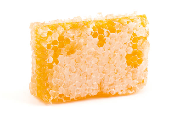 istock Cut Honeycomb Isolated on a White Background 1371880663