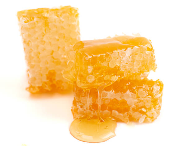 istock Cut Honeycomb Isolated on a White Background 1371880744